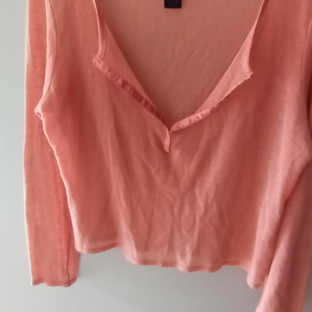 Peach colored cropped sheer sweater